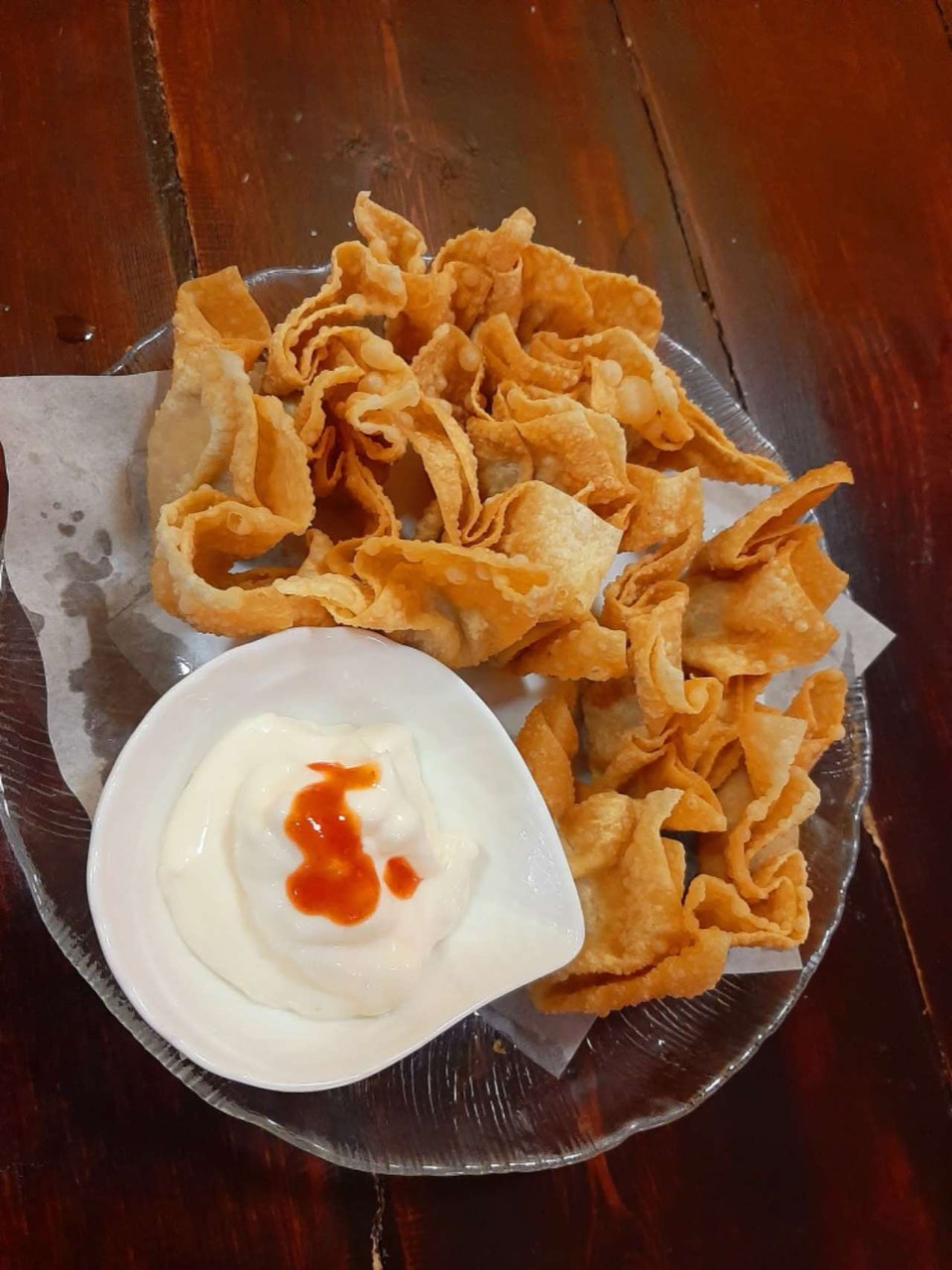 Fried wontons served with dipping sauce.
